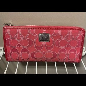 Signature red/silver Coach wallet in very good condition no visible wear.